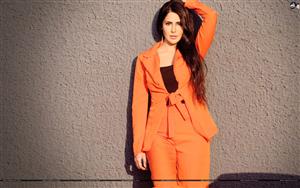 Model Alina Rai strikes a stylish shot in an Orange outfit